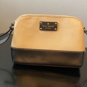 Small beige and black Kate Spade purse.